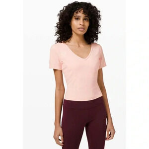 Lululemon Nulu - Camiseta de yoga ajustada de manga corta...